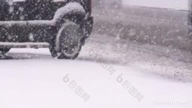 暴风雪中汽车在湿滑的道路上行驶